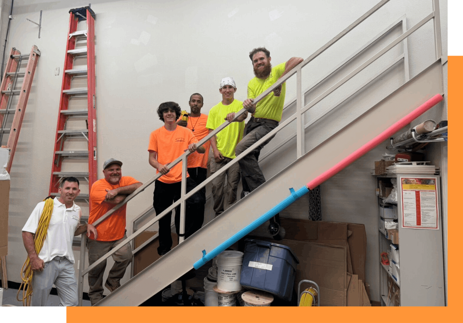 A group of men standing on top of stairs.