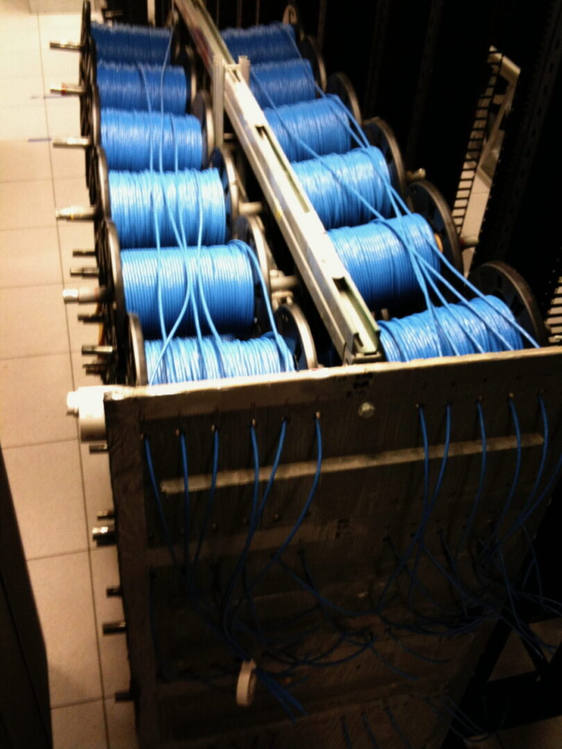 A bunch of blue wires are in the machine