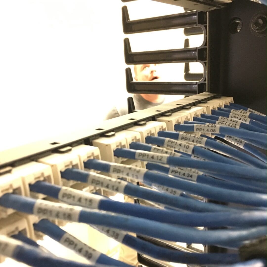 A bunch of blue wires are in the middle of a machine